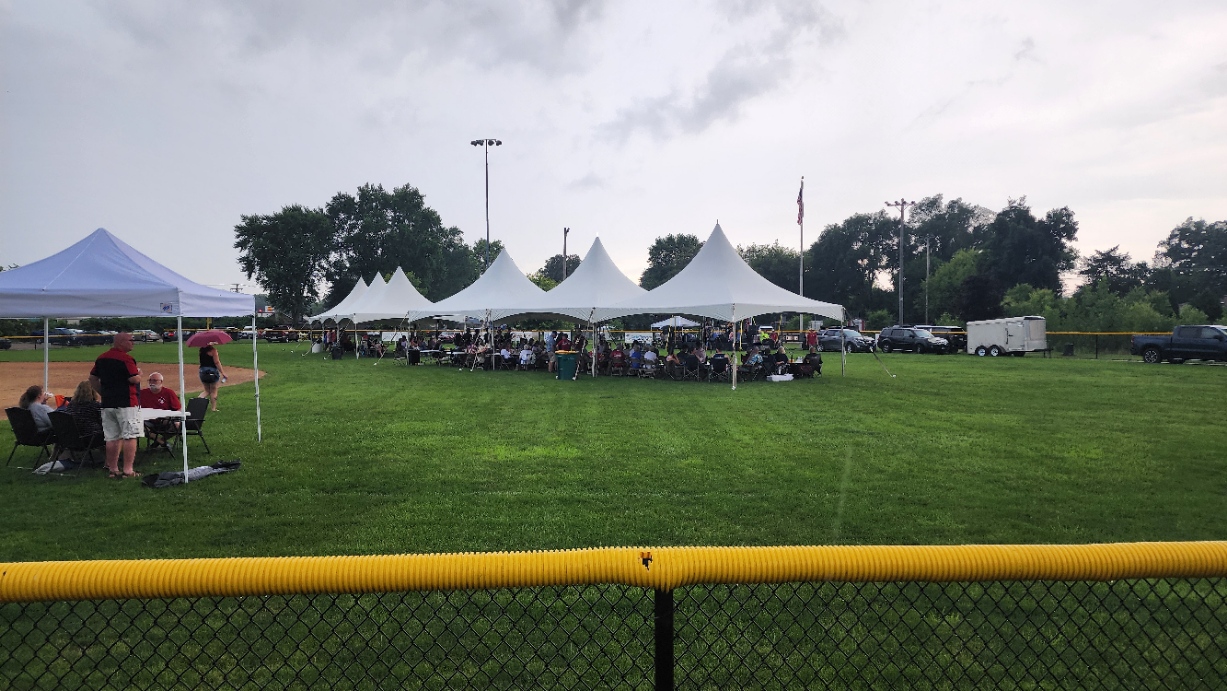 A crowd watches the bands perform
